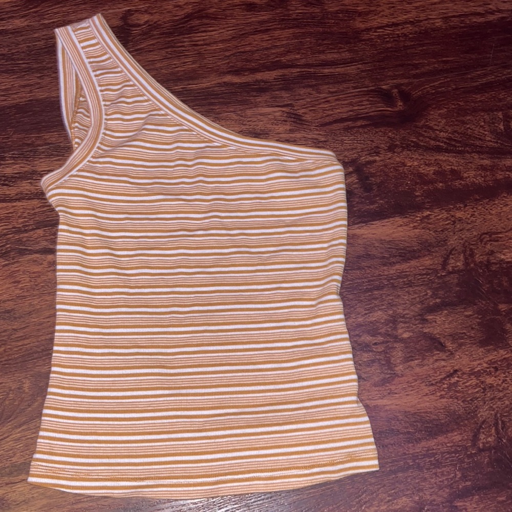 orange and white one shoulder top never worn but tags aren’t on it